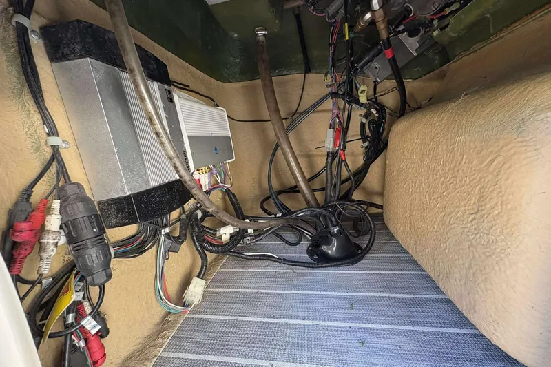 Slide: The Image of Electrical wiring and components inside a 2017 Berkshire 23 boat. - 13