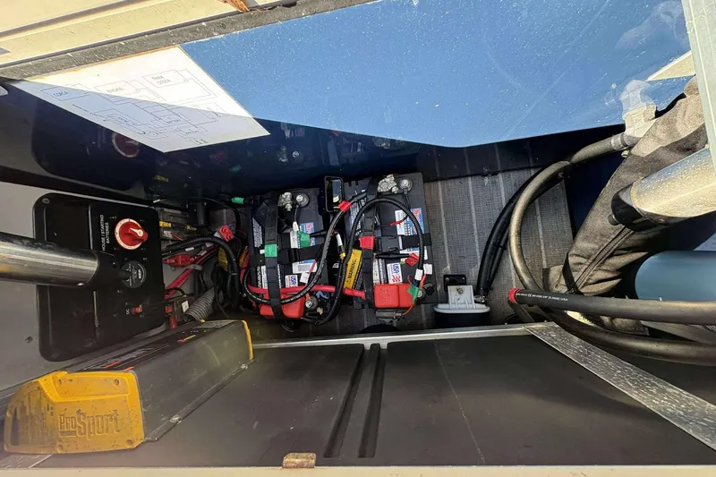 Slide: The Image of 2017 Berkshire 23 battery compartment with wiring and ProSport charger. - 21