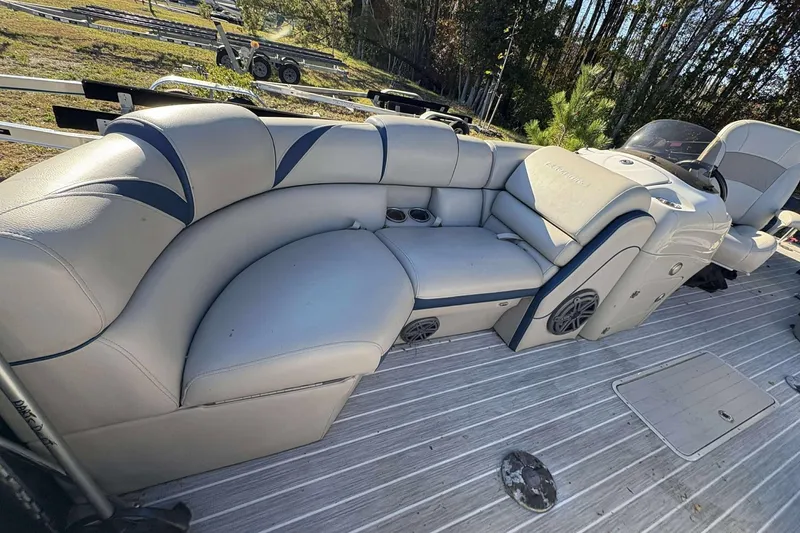 Slide: The Image of 2017 Berkshire 23 boat interior with plush seating and modern design. - 25