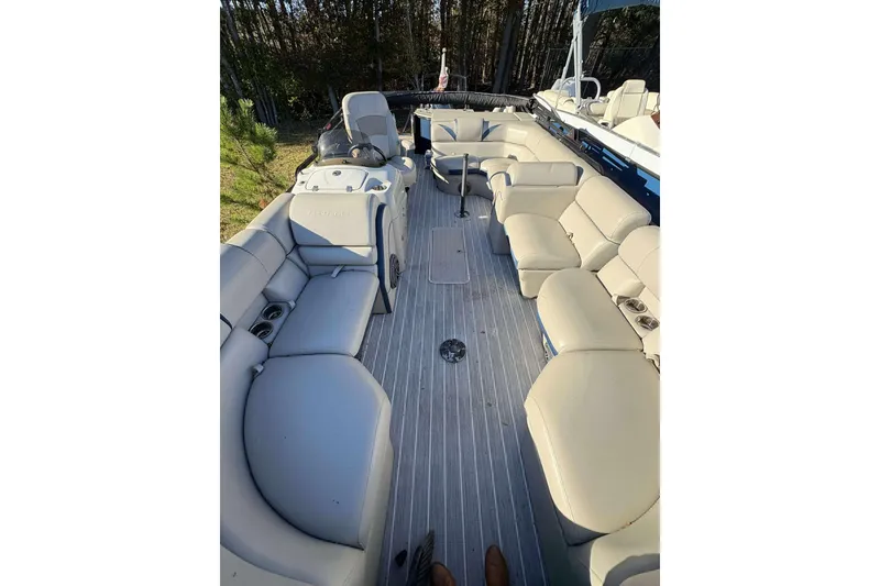 Slide: The Image of 2017 Berkshire 23 boat interior with spacious seating and modern design. - 8