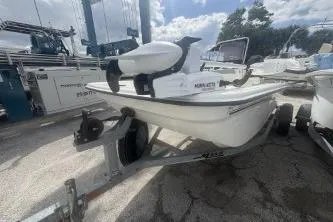 Slide: The Image of 2022 Mako Pro Skiff 15 CC boat on trailer, parked outdoors. - 3