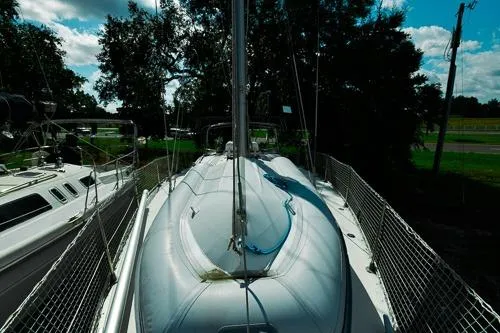 Slide: The Image of Life raft on Jeanneau Sun Odyssey 42.2 sailboat deck, 1999 model. - 12