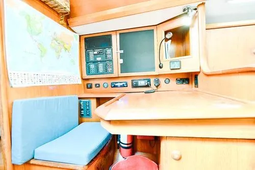 Slide: The Image of Interior of 1999 Jeanneau Sun Odyssey 42.2 yacht with wood finish and cozy seating. - 17