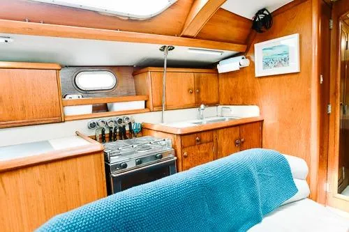 Slide: The Image of Navigation station of 1999 Jeanneau Sun Odyssey 42.2 with map and control panel. - 20