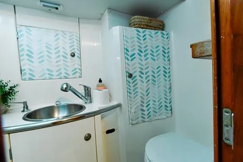 Slide: The Image of Cozy cabin interior of 1999 Jeanneau Sun Odyssey 42.2 sailboat with bedding and pillows. - 25