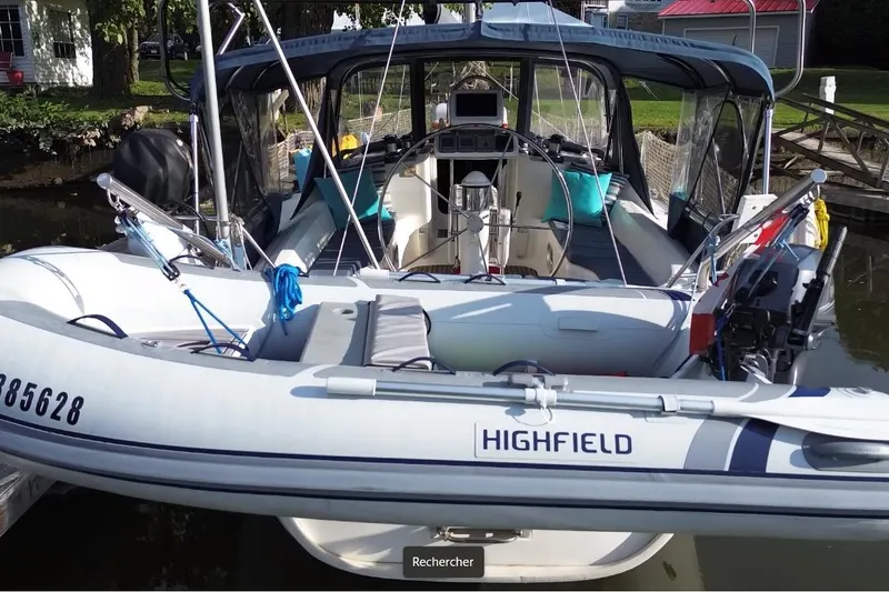 Slide: The Image of Jeanneau Sun Odyssey 42.2 sailboat with Highfield dinghy, docked, 1999 model. - 29