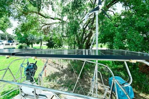 Slide: The Image of Cockpit of 1999 Jeanneau Sun Odyssey 42.2 sailboat with blue cushions and steering wheel. - 7