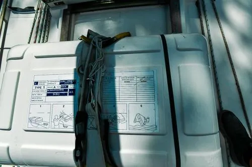 Slide: The Image of 1999 Jeanneau Sun Odyssey 42.2 sailboat on calm blue waters, deck view. - 8