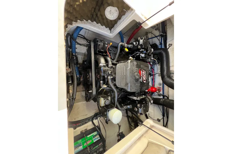 Slide: The Image of Engine compartment of a 2004 Sea Ray 240 Sundeck boat. - 14