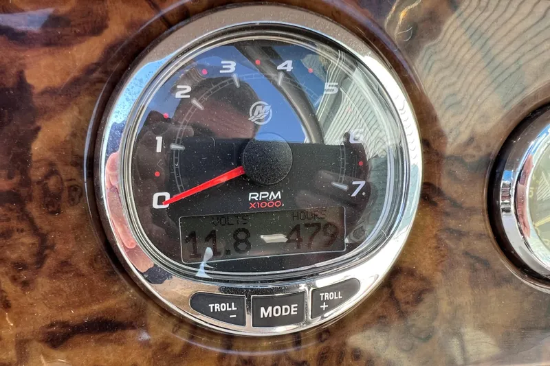 Slide: The Image of Tachometer of 2004 Sea Ray 240 Sundeck showing RPM and engine hours. - 19