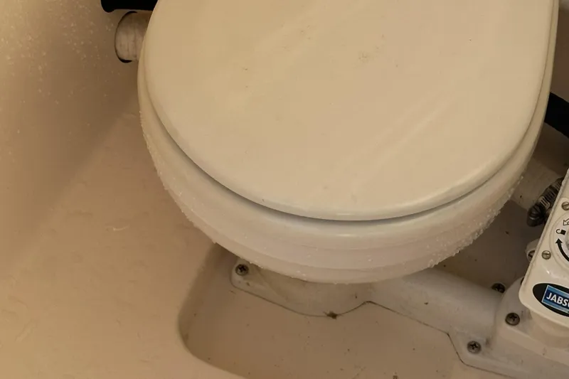 Slide: The Image of 2004 Rinker 282 Captiva Bowrider marine toilet with Jabsco control panel. - 11