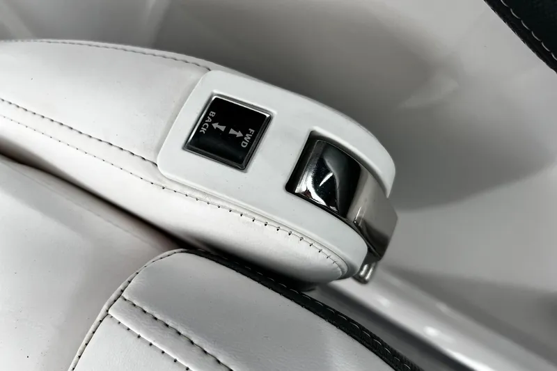 Slide: The Image of Close-up of 2020 Chaparral 297 SSX boat seat adjustment lever in white leather. - 12