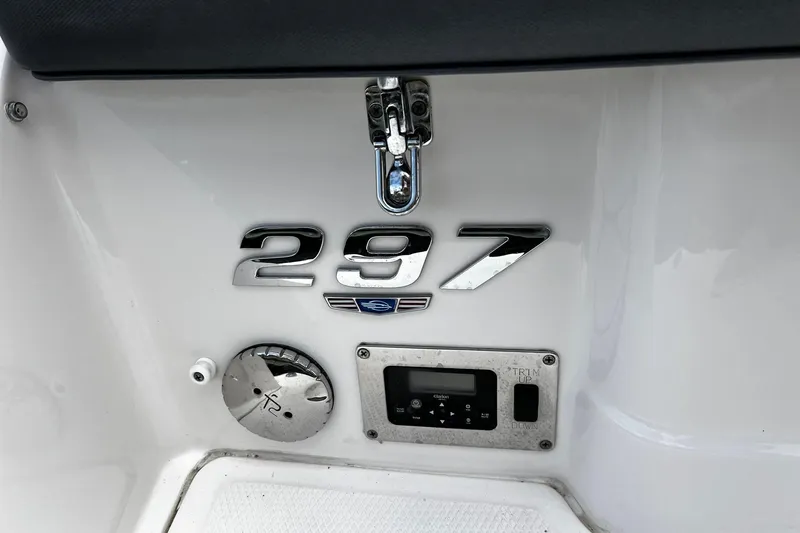 Slide: The Image of 2020 Chaparral 297 SSX boat dashboard with control panel and model emblem. - 18
