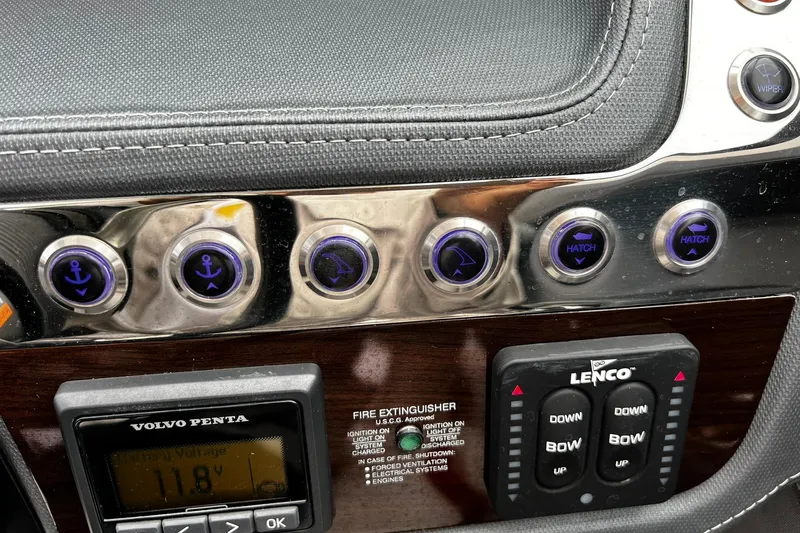 Slide: The Image of Control panel of a 2020 Chaparral 297 SSX boat with various switches and displays. - 26