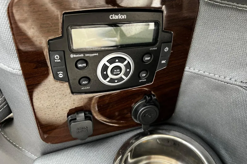 Slide: The Image of 2020 Chaparral 297 SSX boat audio system with Clarion controls and cup holder. - 28