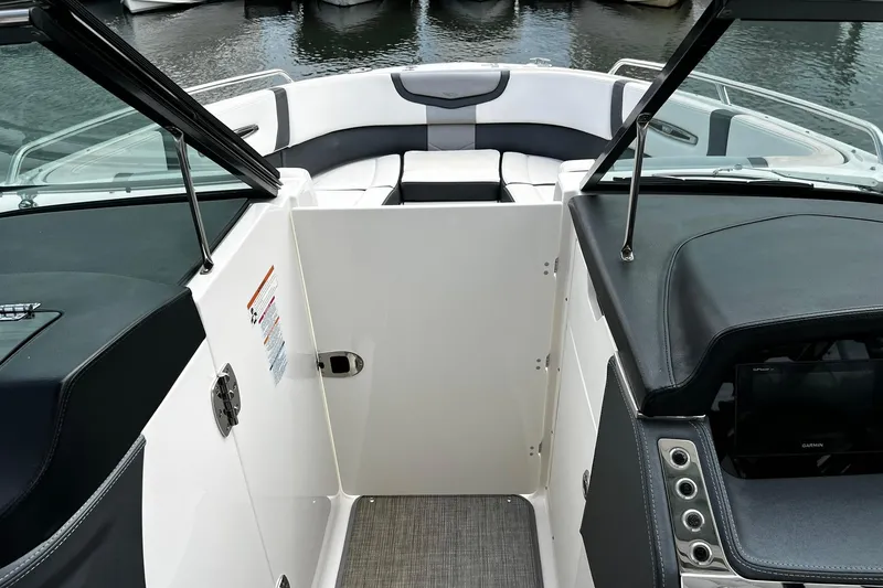 Slide: The Image of 2020 Chaparral 297 SSX boat interior with seating and dashboard view. - 30