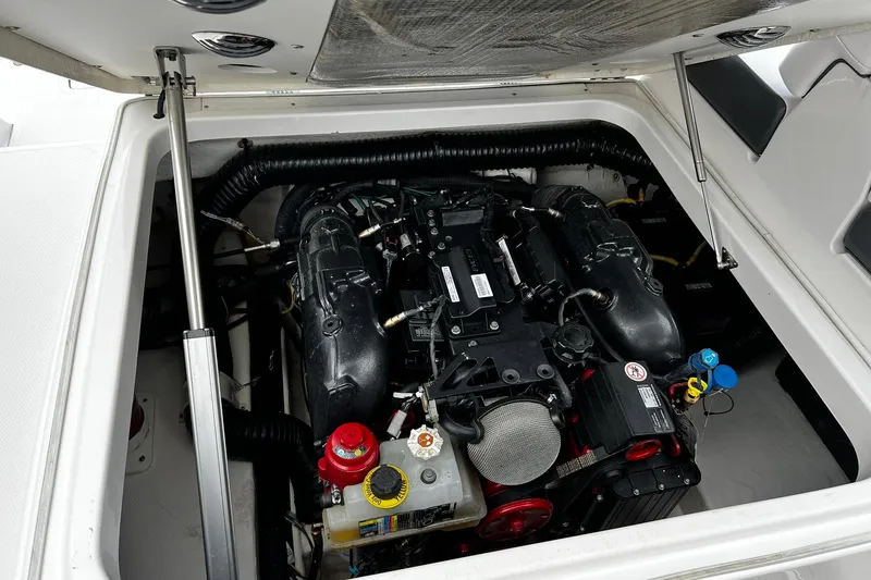 Slide: The Image of 2020 Chaparral 297 SSX engine compartment with detailed view of the motor components. - 37