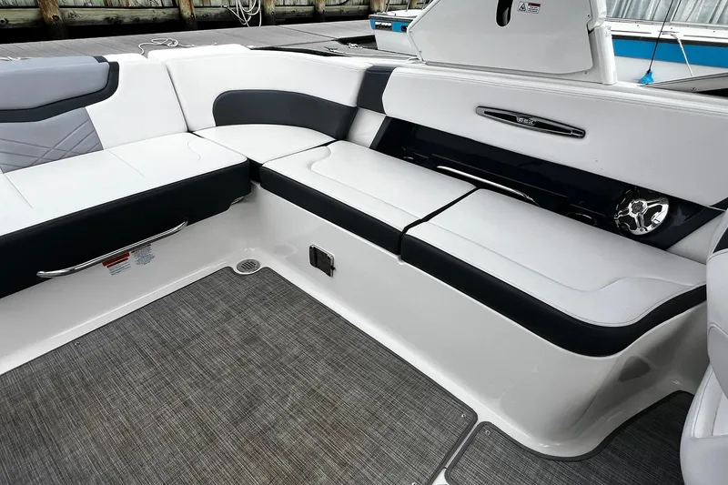 Slide: The Image of 2020 Chaparral 297 SSX boat interior with sleek white and black seating. - 8