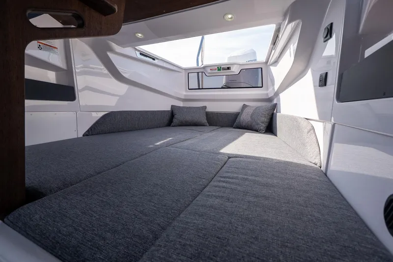 Slide: The Image of Interior cabin of 2026 Axopar 29 Cross Cabin with modern gray upholstery. - 38