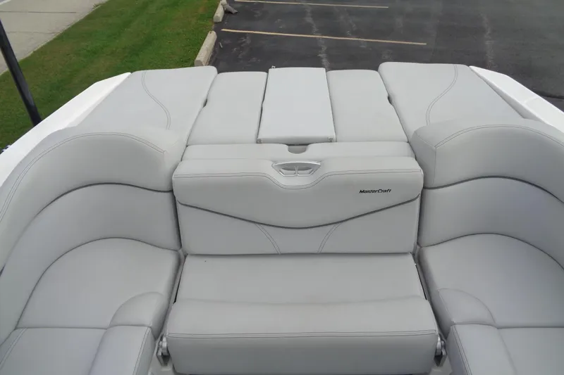 Slide: The Image of 2020 MasterCraft XT23 boat interior with luxurious gray seating. - 15