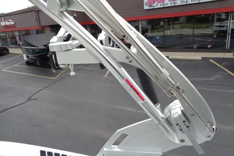Slide: The Image of 2020 MasterCraft XT23 boat tower detail in parking lot setting. - 38