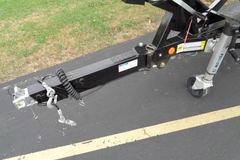 Slide: The Image of Trailer hitch of 2020 MasterCraft XT23 boat on pavement. - 42