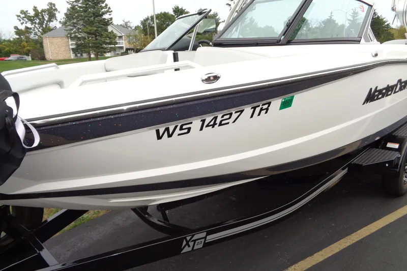 Slide: The Image of 2020 MasterCraft XT23 boat with registration WS 1427 TR on a trailer. - 43