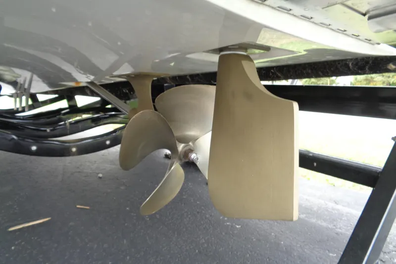 Slide: The Image of Propeller and rudder of 2020 MasterCraft XT23 boat on trailer. - 48