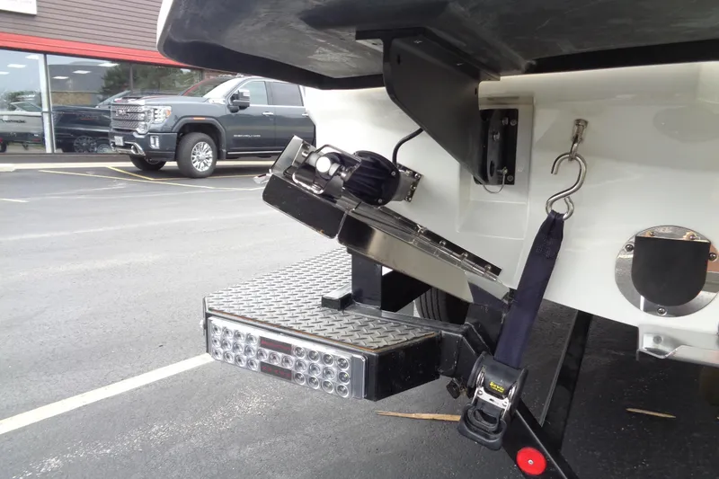 Slide: The Image of 2020 MasterCraft XT23 boat trailer hitch and step detail in parking lot. - 51