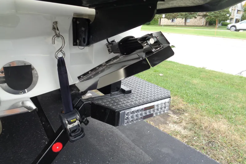 Slide: The Image of 2020 MasterCraft XT23 boat trailer hitch and step detail. - 52