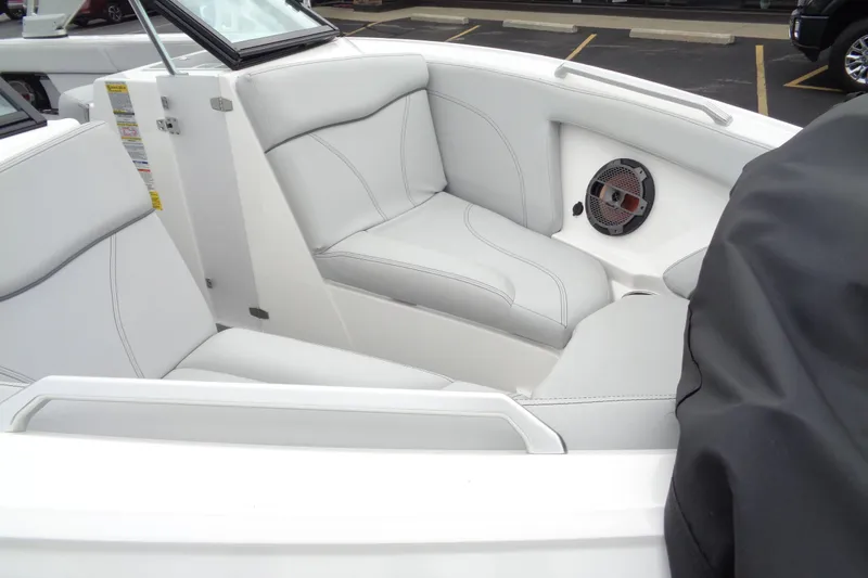 Slide: The Image of 2020 MasterCraft XT23 boat interior with white leather seating and speaker system. - 58