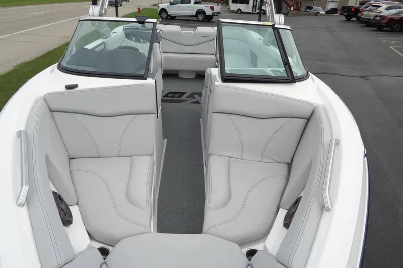 Slide: The Image of 2020 MasterCraft XT23 boat interior with white seating and open bow design. - 59