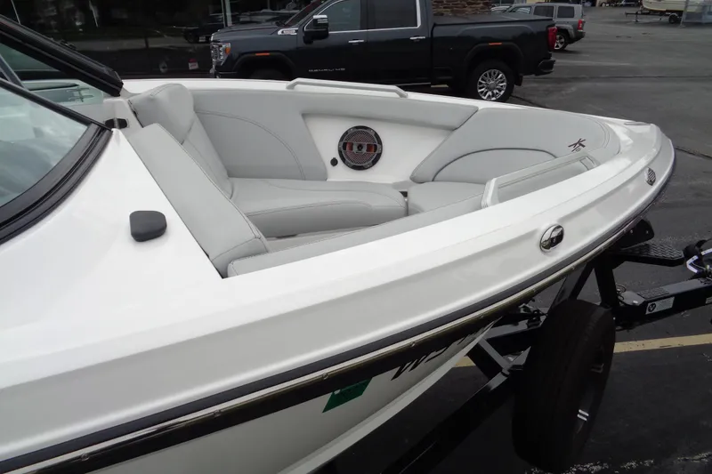 Slide: The Image of 2020 MasterCraft XT23 boat with sleek white interior and modern design. - 62