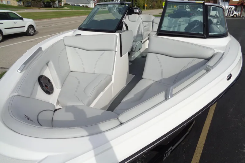 Slide: The Image of 2020 MasterCraft XT23 boat interior with sleek white seating and modern design. - 65