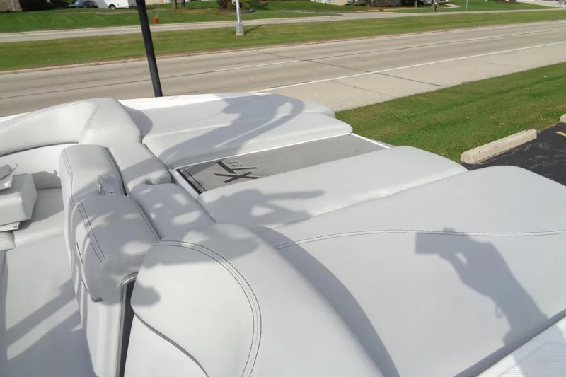 Slide: The Image of 2020 MasterCraft XT23 boat with sleek white seating and modern design. - 68