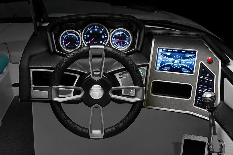 Slide: The Image of Manufacturer Provided Image: 2020 MasterCraft XT23 boat dashboard with steering wheel, gauges, and touchscreen controls. - 74