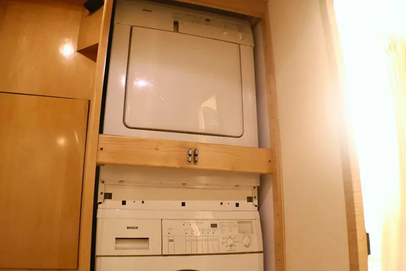 Slide: The Image of Stacked washer and dryer in 2001 Donzi 73 Sport Yacht interior. - 21