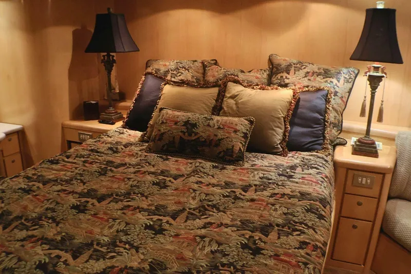 Slide: The Image of Luxurious bedroom interior of 2001 Donzi 73 Sport Yacht with elegant bedding and lamps. - 27