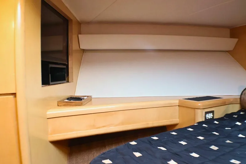 Slide: The Image of Interior cabin of 2001 Donzi 73 Sport Yacht with modern wood finish. - 35