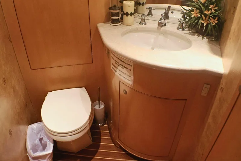 Slide: The Image of Bathroom interior of 2001 Donzi 73 Sport Yacht with wooden cabinetry and modern fixtures. - 36