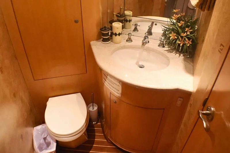 Slide: The Image of Luxurious bathroom in 2001 Donzi 73 Sport Yacht with elegant fixtures and wooden accents. - 37
