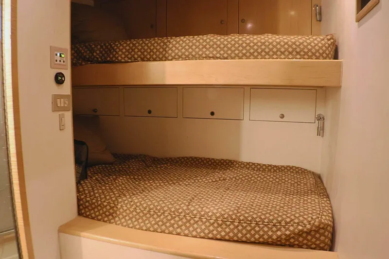 Slide: The Image of Interior of 2001 Donzi 73 Sport Yacht with cozy bunk beds and storage. - 44
