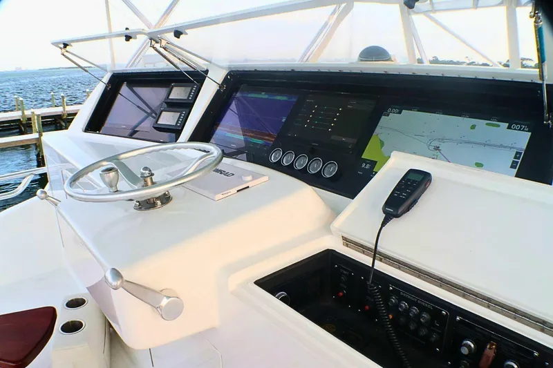 Slide: The Image of Helm of 2001 Donzi 73 Sport Yacht with navigation screens and controls. - 48