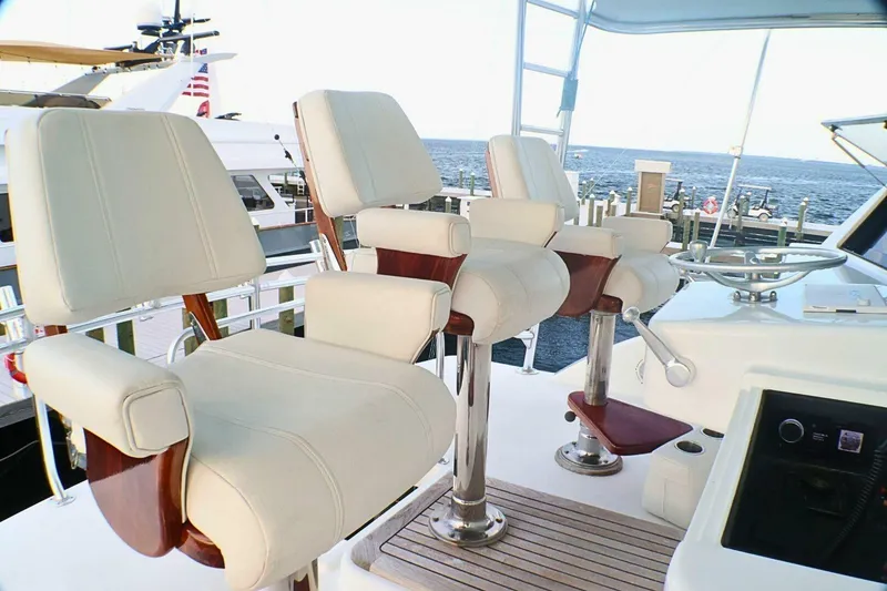Slide: The Image of Luxury helm seating on 2001 Donzi 73 Sport Yacht, overlooking marina and ocean. - 52