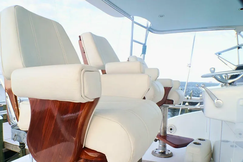 Slide: The Image of Luxury seating on 2001 Donzi 73 Sport Yacht, featuring elegant white upholstery and wooden accents. - 53
