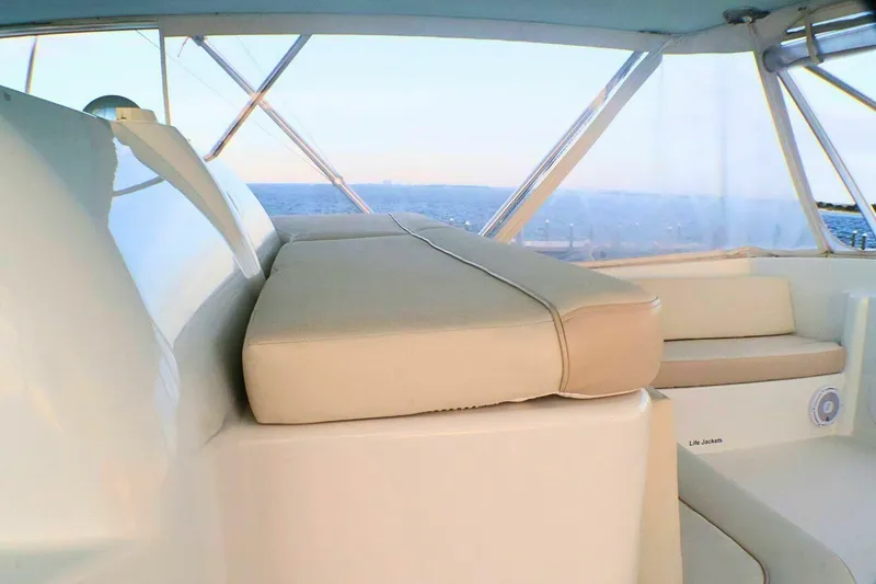 Slide: The Image of Interior of 2001 Donzi 73 Sport Yacht with beige seating and ocean view. - 55