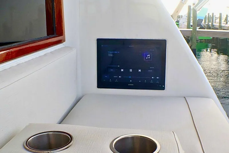 Slide: The Image of Interior of 2001 Donzi 73 Sport Yacht with touchscreen and cup holders. - 66