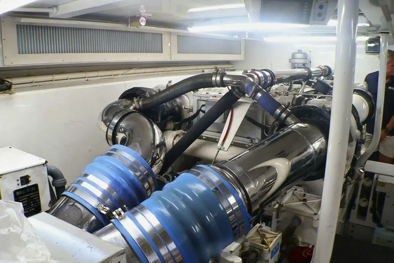 Slide: The Image of Engine room of a 2001 Donzi 73 Sport Yacht with visible machinery and components. - 69
