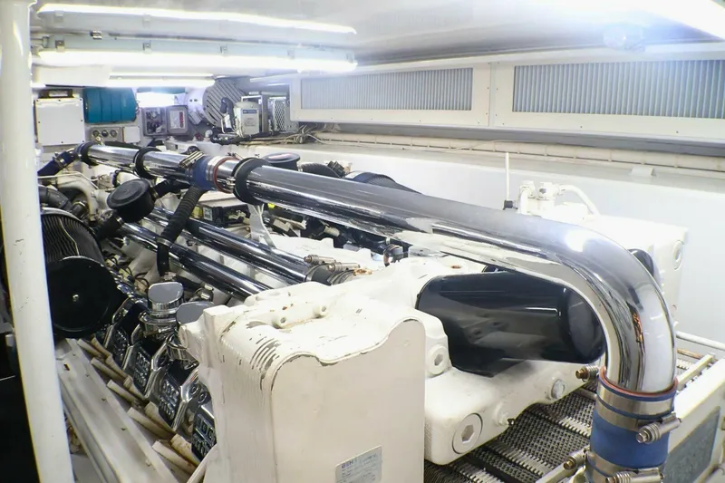 Slide: The Image of Engine room of a 2001 Donzi 73 Sport Yacht with polished components. - 74