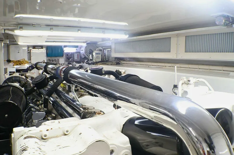 Slide: The Image of Engine room of 2001 Donzi 73 Sport Yacht with polished metal components. - 76
